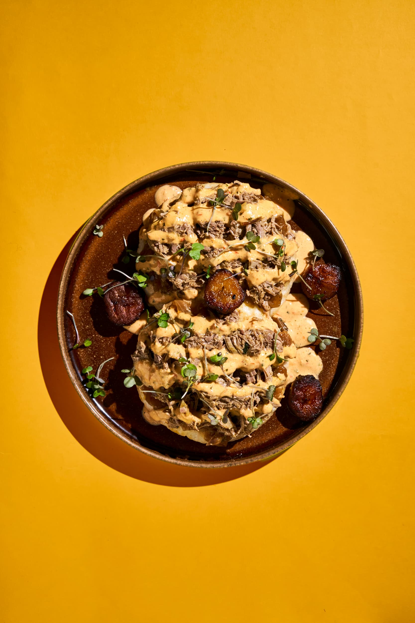 Masa Yassa: pulled lamb, yassa onions and piri-piri sauce