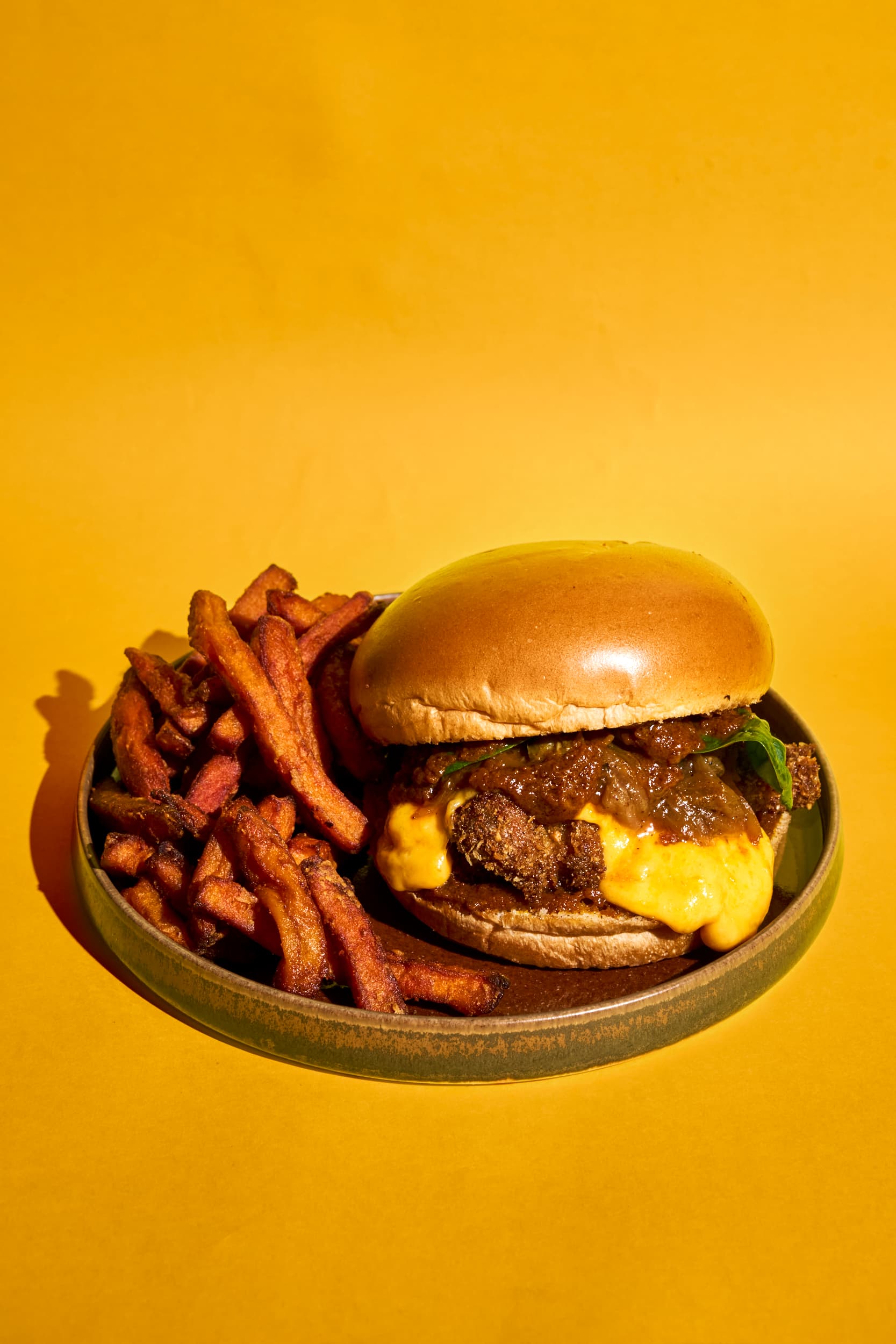 Yassa Burger: Kuti Fried Chicken, yassa onions and cheddar
